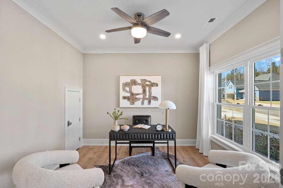 One of two beautifully appointed Offices with solid French doors, offering privacy, functionality, and the same refined finishes found throughout the home - perfect for remote work or focused study.