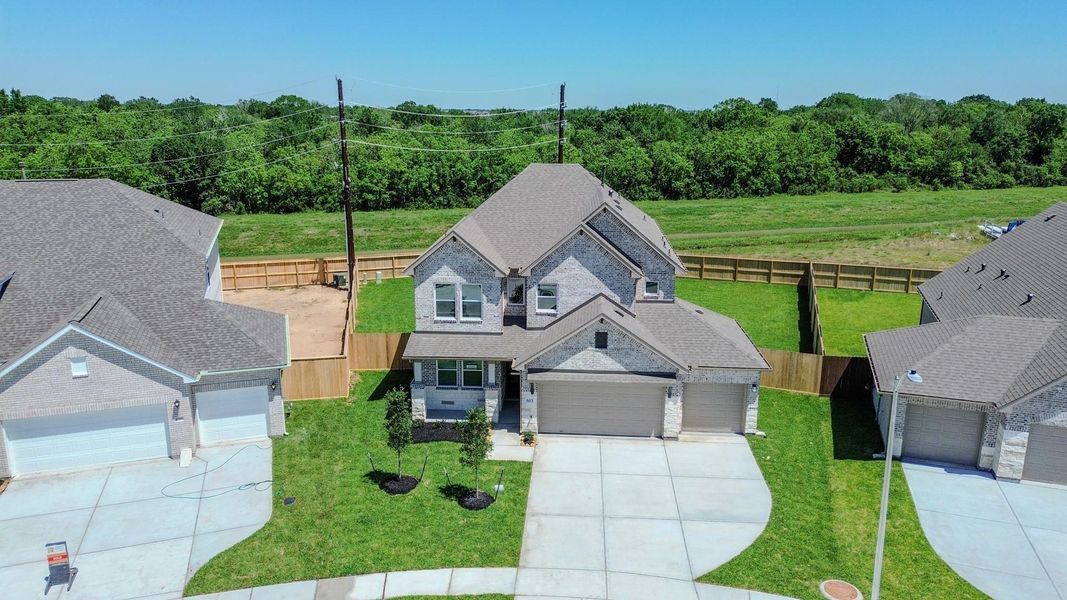 Front exterior of a new home in Foxtail Palms, Manvel, TX, highlighting curb appeal (Image 19).