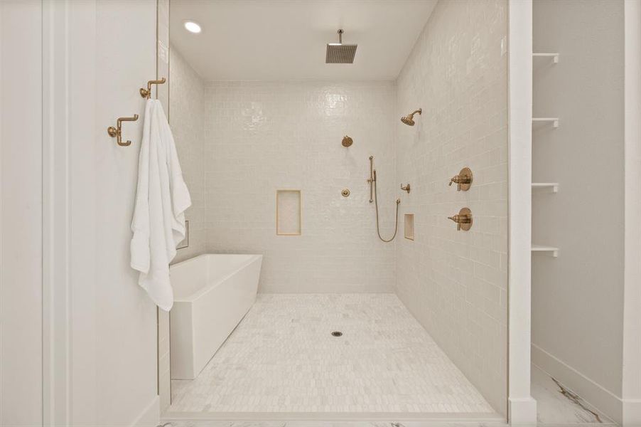 Bathroom featuring a tile shower and recessed lighting Bathroom featuring a tile shower and recessed lighting