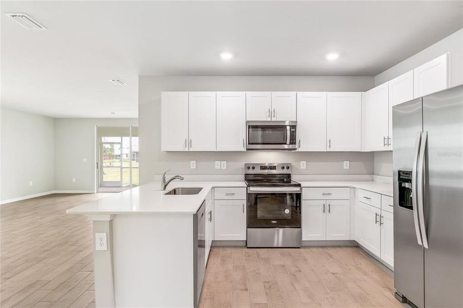 Furnished interior view inside a new home in Heritage Lake Park, Punta Gorda (Image 7).