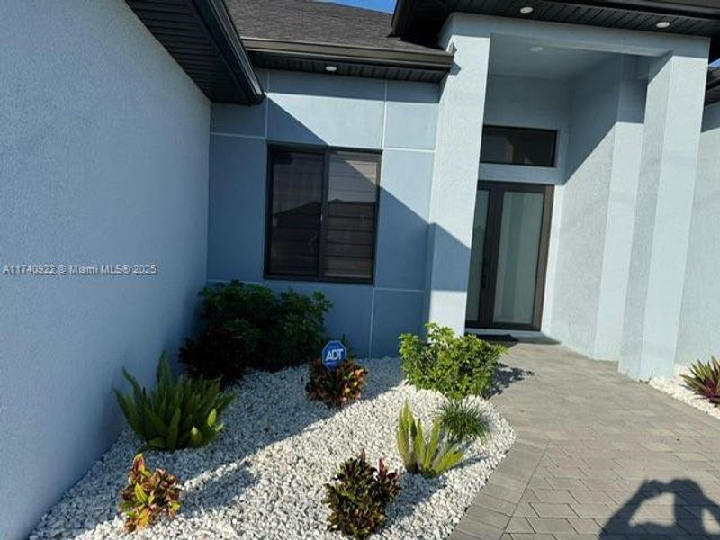 Front exterior of a new home in , Cape Coral, FL, highlighting curb appeal (Image 11).