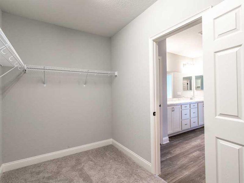 Walk-in wardrobe in the owner`s suite - Wayfair by Highland Homes