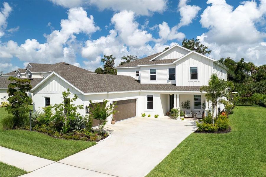 Front exterior of a new home in Skye Ranch Community Group Page, Sarasota, FL, highlighting curb appeal (Image 24).