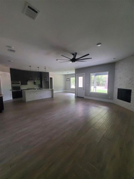 LIVING ROOM LEADING INTO THE KITCHEN AND BREAKFAST AREA. LIVING ROOM LEADING INTO THE KITCHEN AND BREAKFAST AREA.