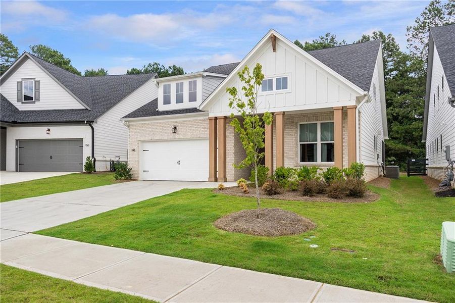Front exterior of a new home in , Woodstock, GA, highlighting curb appeal (Image 2). Front exterior of a new home in , Woodstock, GA, highlighting curb appeal (Image 2).