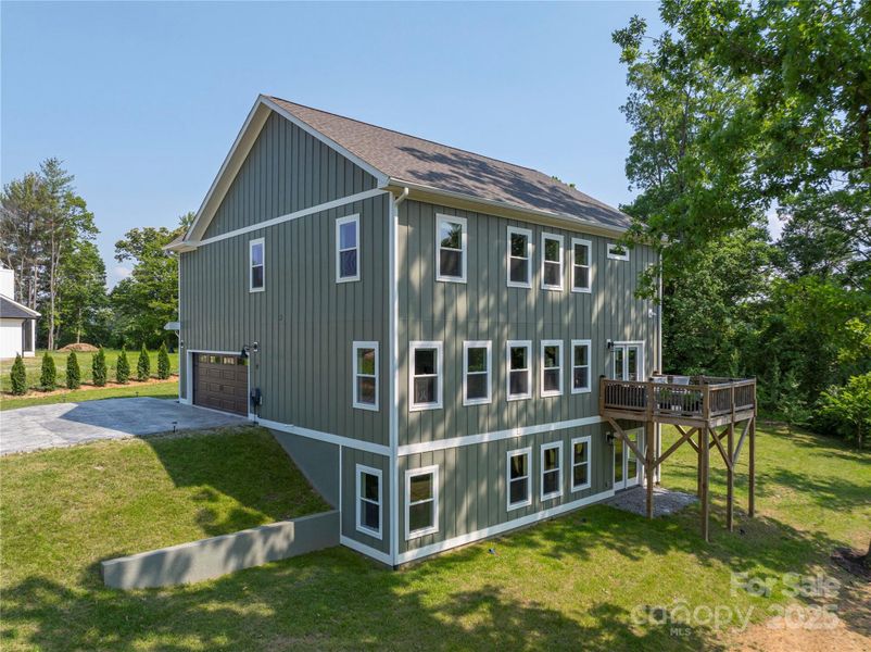 Front exterior of a new home in , Candler, NC, highlighting curb appeal (Image 24).