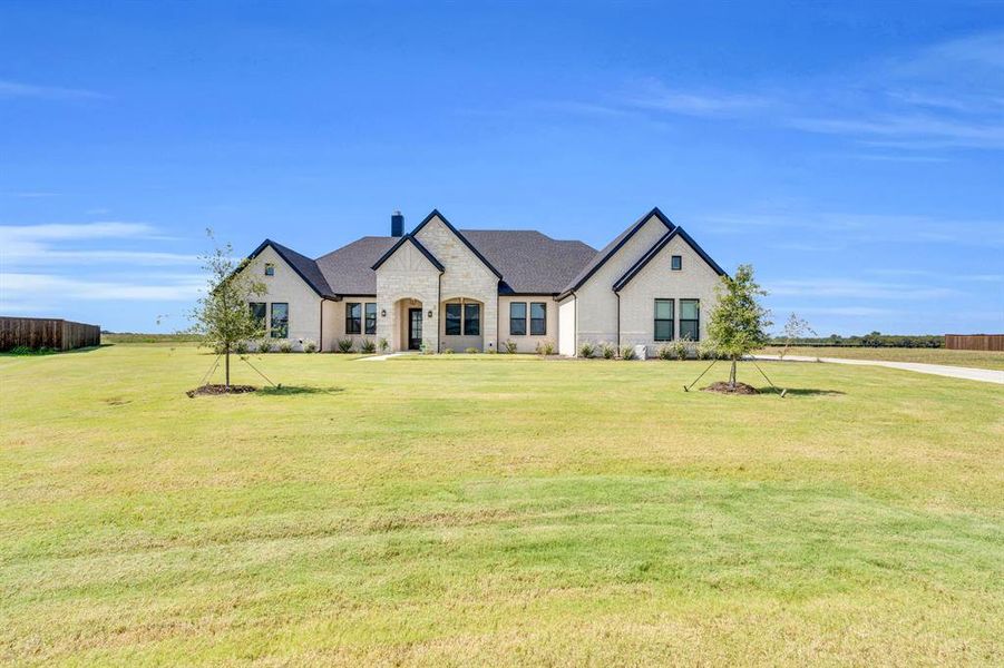 Front exterior of a new home in Springside Estates II, Waxahachie, TX, highlighting curb appeal (Image 15).