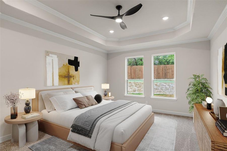 Carpeted bedroom with ceiling fan, a raised ceiling, and ornamental molding