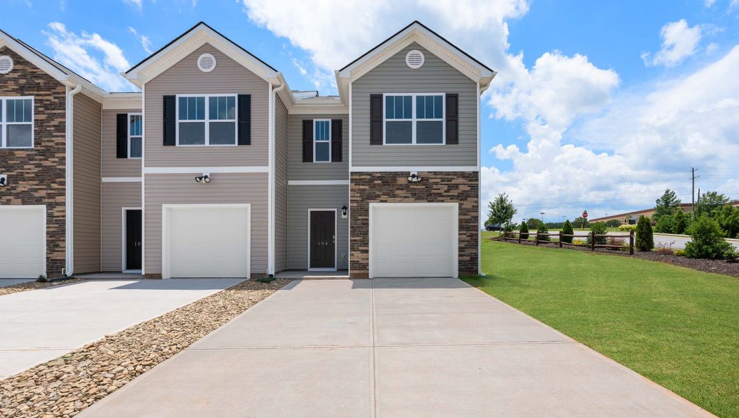 Front exterior of a new home in Tanglewood Townes, Greenville, SC, highlighting curb appeal (Image 1).