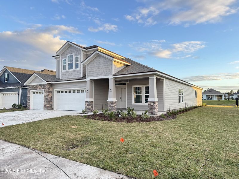 Front exterior of a new home in , Green Cove Springs, FL, highlighting curb appeal (Image 1). Front exterior of a new home in , Green Cove Springs, FL, highlighting curb appeal (Image 1).