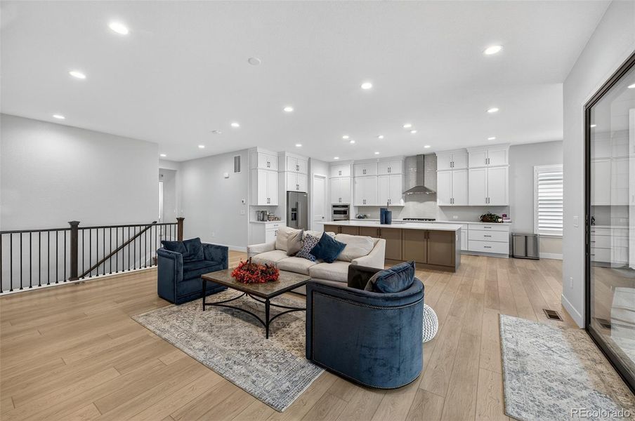 Living Room to Kitchen View – Bright and airy open floor plan connecting the living room and chef’s kitchen, creating a perfect flow for gatherings.