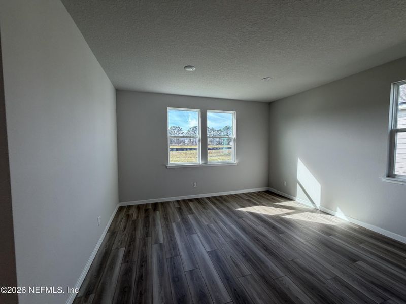 Spacious, unfurnished interior of a new home in The Cypress Series at Reserve East, Flagler Beach (Image 25).