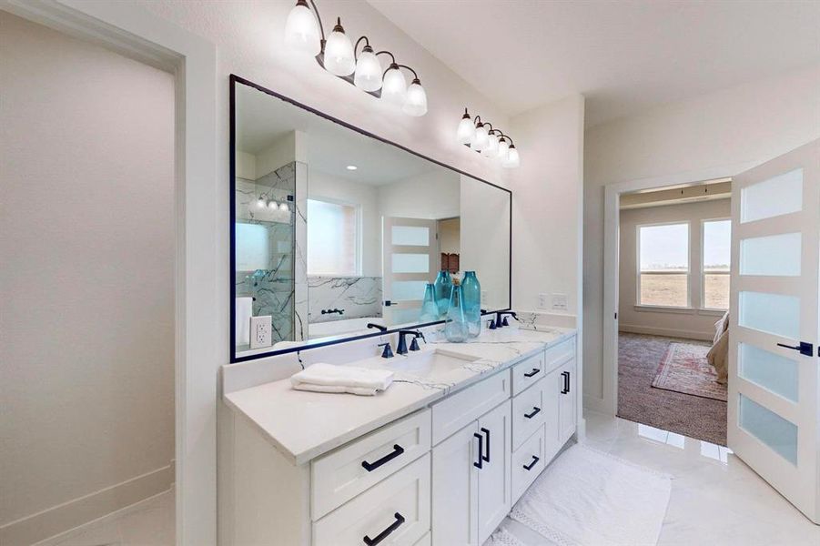 Bathroom featuring vanity and a tile shower