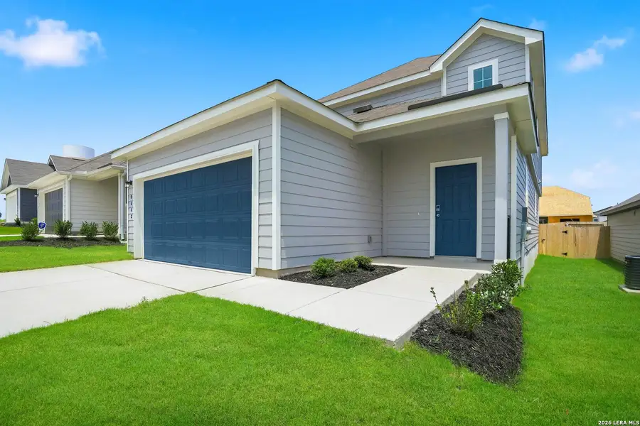 Front exterior of a new home in Hickory Ridge, Elmendorf, TX, highlighting curb appeal (Image 1). Front exterior of a new home in Hickory Ridge, Elmendorf, TX, highlighting curb appeal (Image 1).