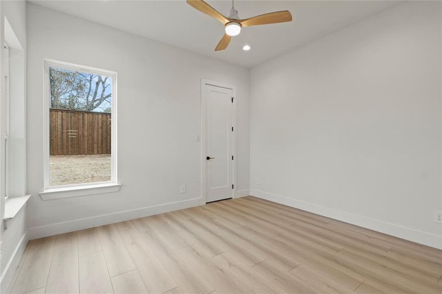 Spare room featuring light wood-style flooring, ceiling fan, and recessed lighting Spare room featuring light wood-style flooring, ceiling fan, and recessed lighting