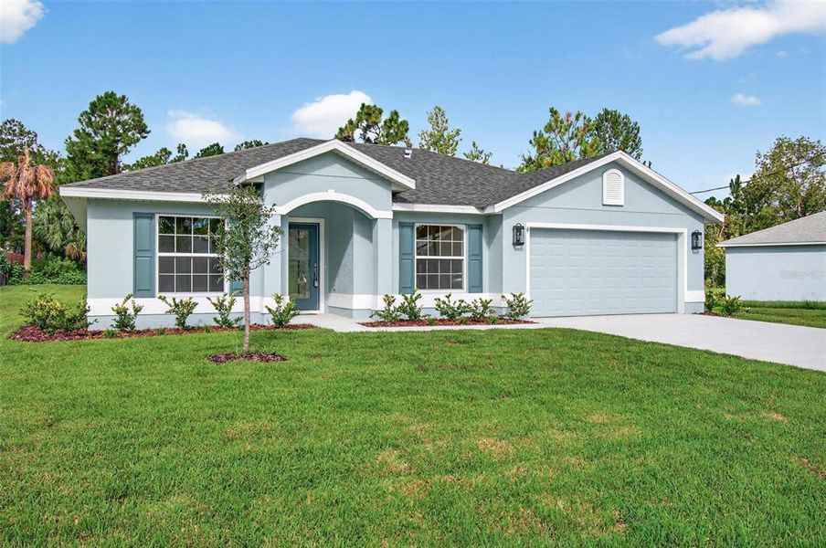 Front exterior of a new home in , Palm Coast, FL, highlighting curb appeal (Image 26).