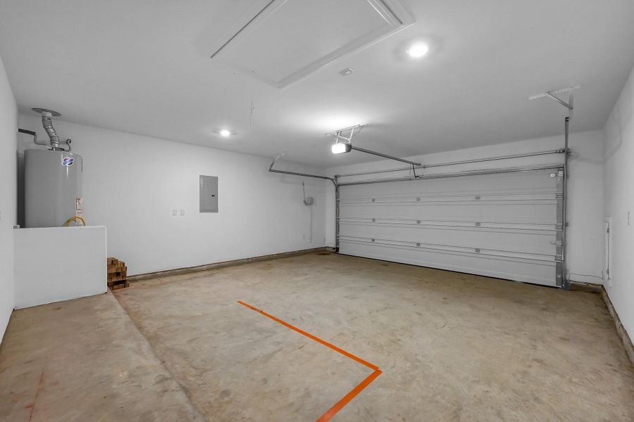 2 Car Garage with Access to Attic and super accessible hot water heater!