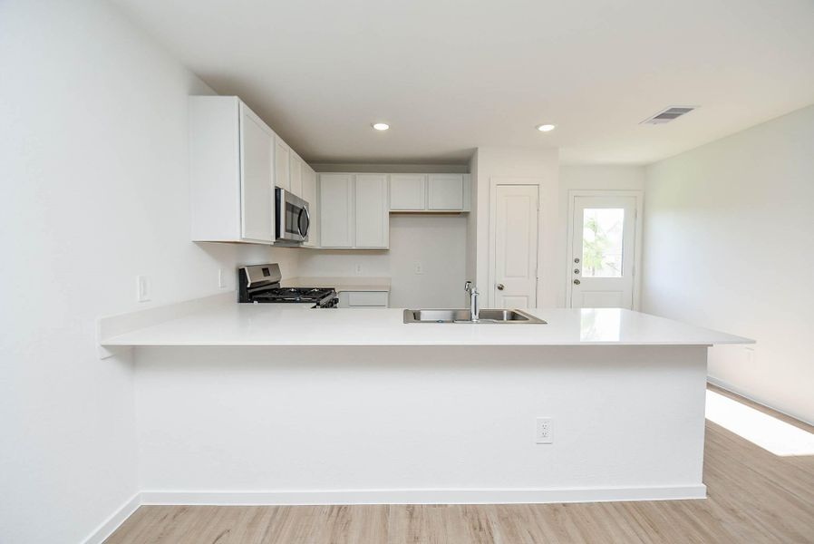 Furnished interior view inside a new home in Ladera Trails, Conroe (Image 9).
