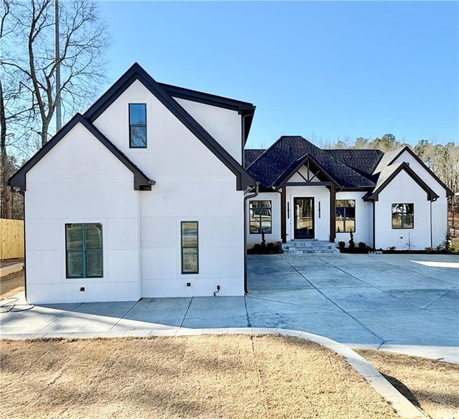 Front exterior of a new home in , Flowery Branch, GA, highlighting curb appeal (Image 6).
