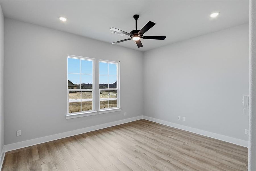 Unfurnished room featuring ceiling fan, recessed lighting, and light wood-type flooring