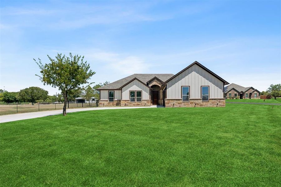 View of front of house with a front lawn