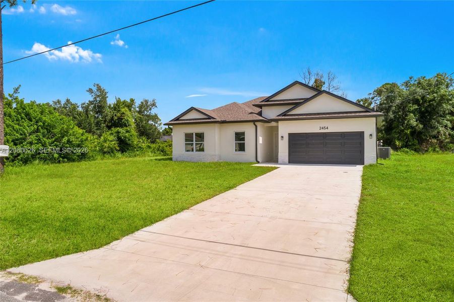 Front exterior of a new home in , North Port, FL, highlighting curb appeal (Image 2). Front exterior of a new home in , North Port, FL, highlighting curb appeal (Image 2).