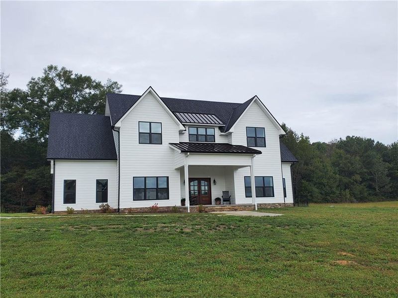 Front exterior of a new home in , Resaca, GA, highlighting curb appeal (Image 1). Front exterior of a new home in , Resaca, GA, highlighting curb appeal (Image 1).