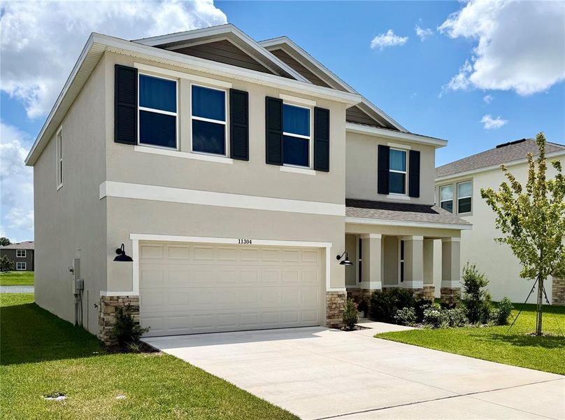 Front exterior of a new home in , San Antonio, FL, highlighting curb appeal (Image 1). Front exterior of a new home in , San Antonio, FL, highlighting curb appeal (Image 1).
