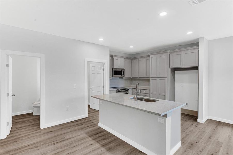 Kitchen, half bath, utility room