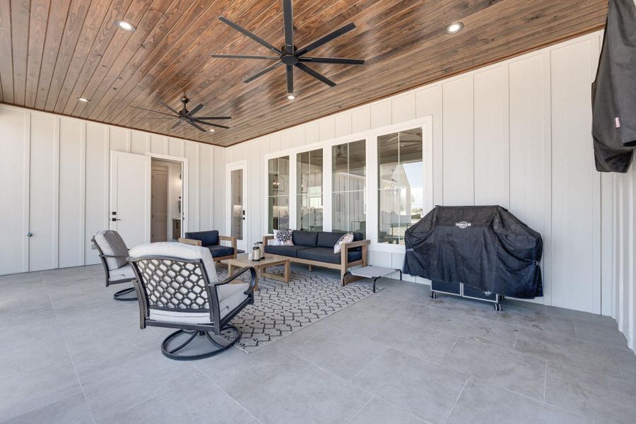 View of patio / terrace with a ceiling fan, a grill, and outdoor lounge area