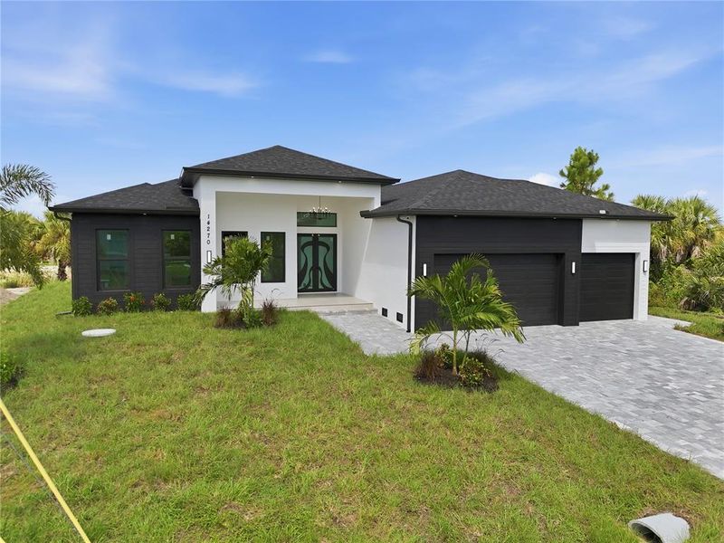 Front exterior of a new home in , Port Charlotte, FL, highlighting curb appeal (Image 20). Front exterior of a new home in , Port Charlotte, FL, highlighting curb appeal (Image 20).