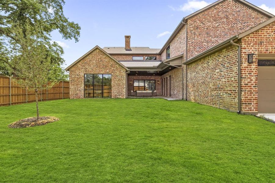 Backyard with rear 3-car garage entrance