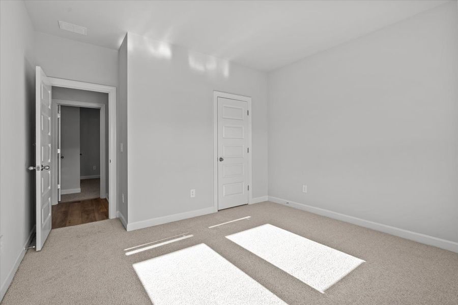 Spacious, unfurnished interior of a new home in The Farm at Wells Creek - Signature Collection, Gray Court (Image 15).