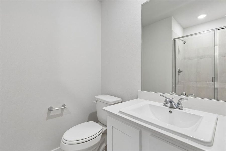 Bathroom in the Oscar home plan by Trophy Signature Homes – REPRESENTATIVE PHOTO