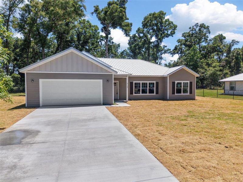 Front exterior of a new home in , Trenton, FL, highlighting curb appeal (Image 29).
