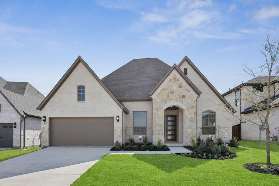 Front exterior of a new home in Trinity Falls, McKinney, TX, highlighting curb appeal (Image 23). Front exterior of a new home in Trinity Falls, McKinney, TX, highlighting curb appeal (Image 23).