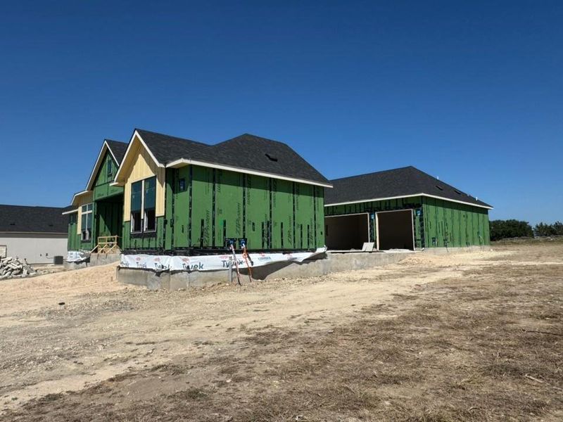 View of side of property featuring board and batten siding and an outbuilding