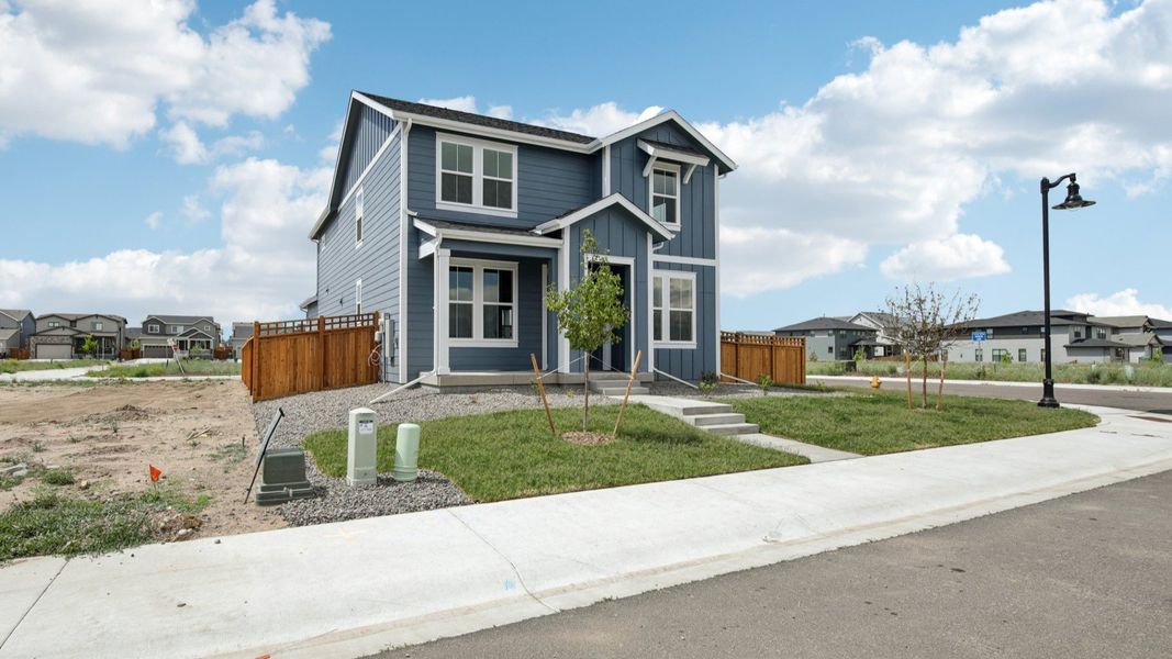 Front exterior of a new home in Timnath Lakes, Timnath, CO, highlighting curb appeal (Image 2). Front exterior of a new home in Timnath Lakes, Timnath, CO, highlighting curb appeal (Image 2).