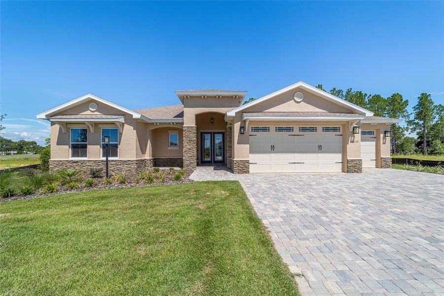 Front exterior of a new home in , Ocala, FL, highlighting curb appeal (Image 26).