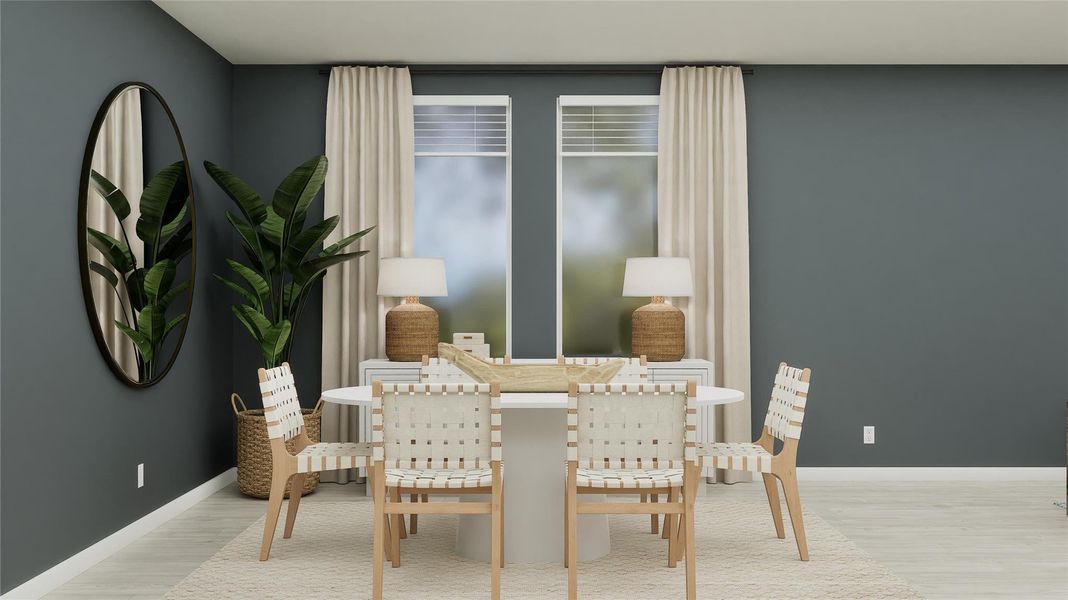 Dining room featuring wood finished floors and baseboards Dining room featuring wood finished floors and baseboards