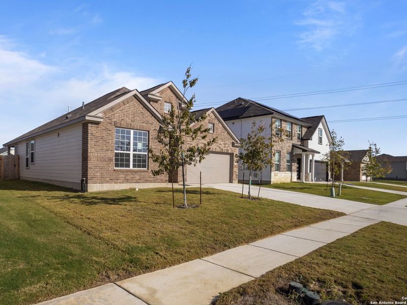 Front exterior of a new home in Hannah Heights, Seguin, TX, highlighting curb appeal (Image 26).