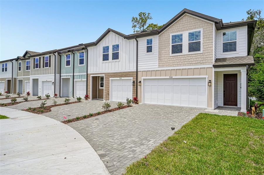 Front exterior of a new home in Montague Chase, Tampa, FL, highlighting curb appeal (Image 2). Front exterior of a new home in Montague Chase, Tampa, FL, highlighting curb appeal (Image 2).