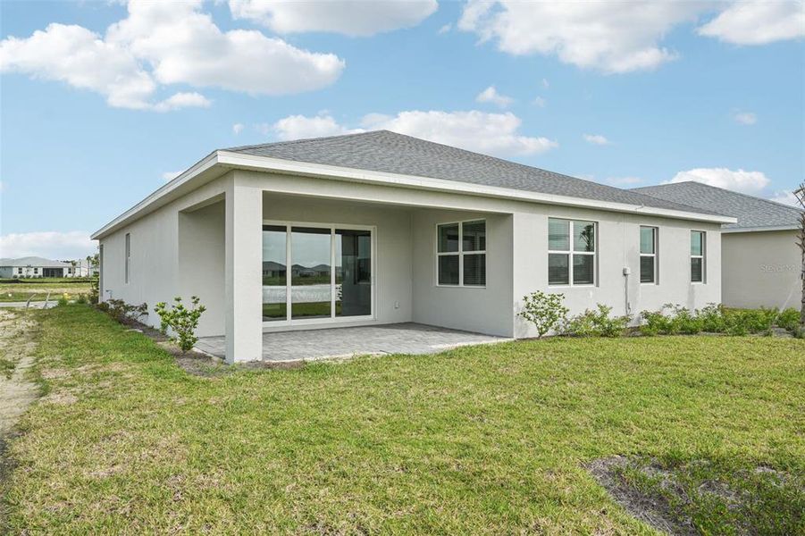 Exterior details and patio area of a home in Crescent Lakes - Signature Series, Punta Gorda (Image 21).