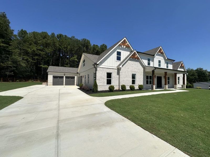 Front exterior of a new home in , Lawrenceville, GA, highlighting curb appeal (Image 1). Front exterior of a new home in , Lawrenceville, GA, highlighting curb appeal (Image 1).