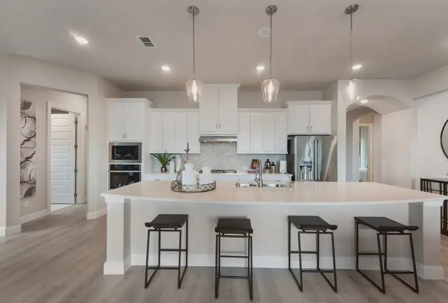 Representative furnished interior of a home built from the Waylon by Chesmar Homes in 6 Creeks, Kyle (Image 4).