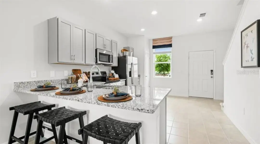 Furnished interior view inside a new home in The Townhomes at Westview, Kissimmee (Image 4).