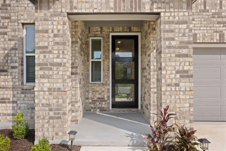 Property entrance with brick siding
