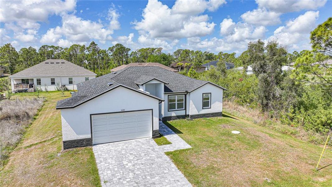 Front exterior of a new home in , Port Charlotte, FL, highlighting curb appeal (Image 24).