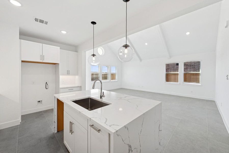 Large island with waterfall edge quartz counters