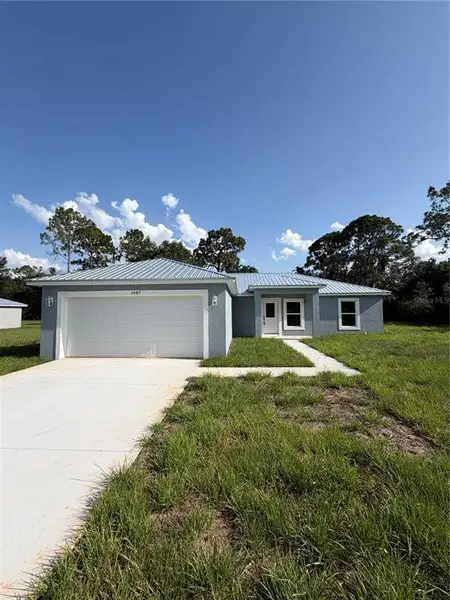 Front exterior of a new home in , Lake Wales, FL, highlighting curb appeal (Image 1). Front exterior of a new home in , Lake Wales, FL, highlighting curb appeal (Image 1).
